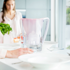 women cooking with pink filter jug 